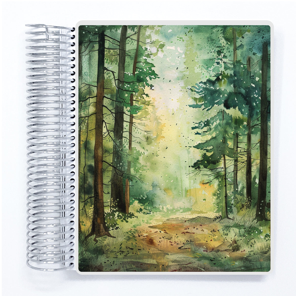 a spiral notebook with a painting of a forest scene