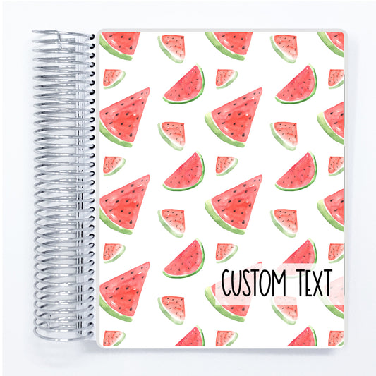 a spiral notebook with a watermelon pattern on it