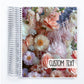 a spiral notebook with a photo of pink and white flowers