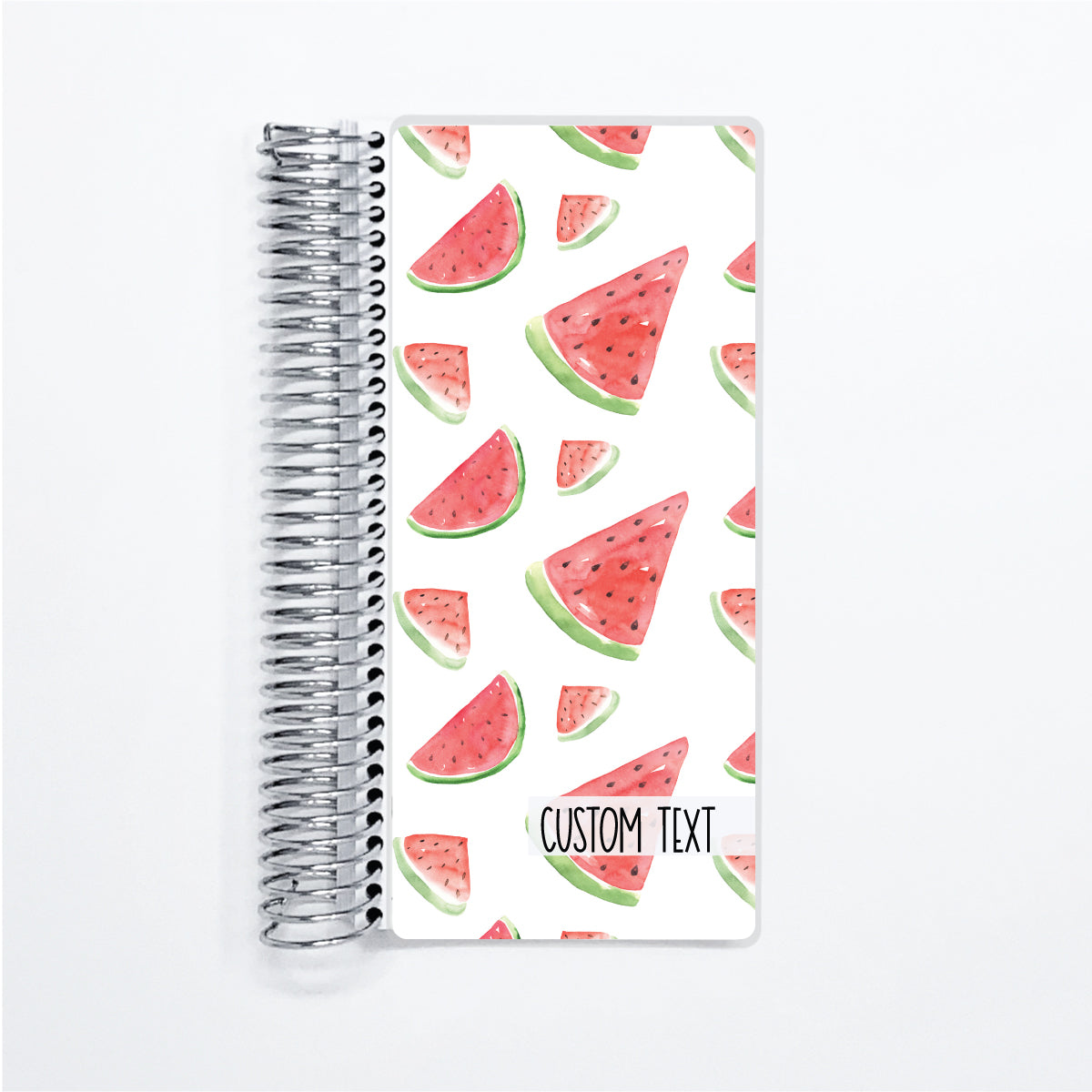 a spiral notebook with a watermelon pattern on it